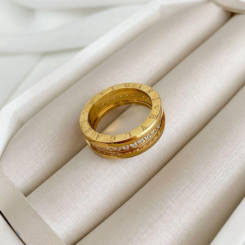 ALIANÇA AÇO BVLGARI MEIO EM PEDRAS