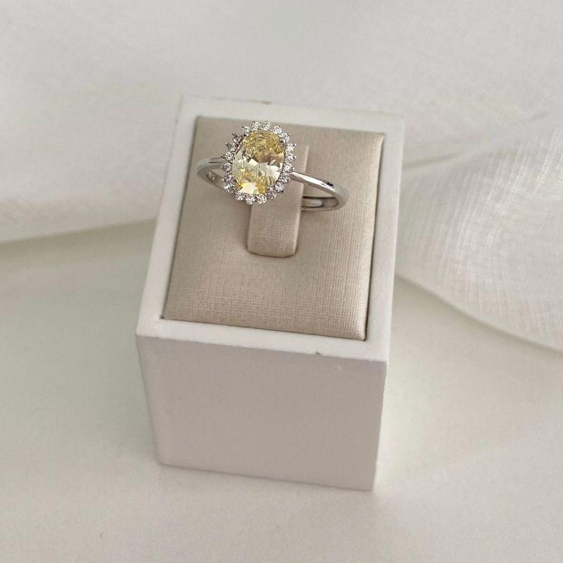 ANEL PT PEDRA OVAL AMARELA CRAVEJADA